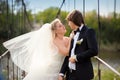 Bride groom kiss on the bridge Royalty Free Stock Photo