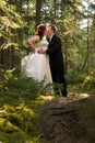 Bride and Groom Kissing in Forest Royalty Free Stock Photo