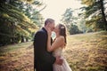 Bride and Groom kissing in forest Royalty Free Stock Photo