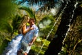 Bride and groom kissing near the splashing fountain Royalty Free Stock Photo