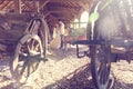 Bride and groom kissing near wooden carriage Royalty Free Stock Photo