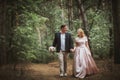 Bride and groom kissing in the summer forest Royalty Free Stock Photo