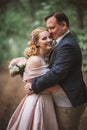 Bride and groom kissing in the summer forest Royalty Free Stock Photo