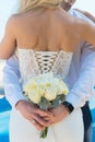 Bride and Groom, Kissing at Sunset on a Beautiful Beach, Romantic Married Couple Royalty Free Stock Photo