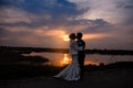 Bride and Groom kissing at Sunset beautiful Romantic Married Couple Royalty Free Stock Photo