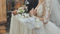 The bride and groom are kneeling during a wedding in the Catholic Church. Royalty Free Stock Photo