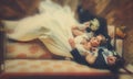 Bride and groom lay carelessly on the old sofa