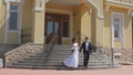 The bride and groom leave the country mansion for a wedding ceremony