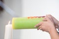 Bride and groom lighting a candle together on a wedding day. Royalty Free Stock Photo