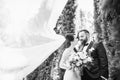 Bride and groom look at each other in black and white