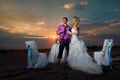 Bride and groom making at sunset Royalty Free Stock Photo