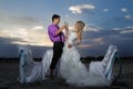 Bride and groom making at sunset Royalty Free Stock Photo