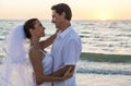 Bride and Groom Married Couple Sunset Beach Wedding Royalty Free Stock Photo