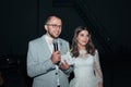 The bride and groom at the microphone party thank guests and parents Royalty Free Stock Photo