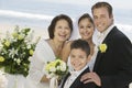 Bride and Groom with mother and brother outdoors (portrait) Royalty Free Stock Photo
