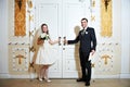 Bride and groom near doors of wedding hall Royalty Free Stock Photo
