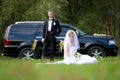 Bride and groom next to wedding car Royalty Free Stock Photo