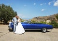 Bride and Groom next to wedding car Royalty Free Stock Photo