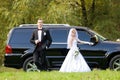 Bride and groom next to wedding car Royalty Free Stock Photo