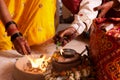 Bride and groom offering to holy fire, a typical wedding ritual during marriage Royalty Free Stock Photo