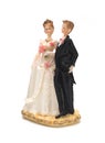 Bride and groom, old cake topper on white background Royalty Free Stock Photo