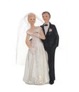 Bride and groom, old cake topper on white background Royalty Free Stock Photo