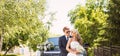 Bride and groom over wedding car background Royalty Free Stock Photo