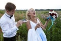 The bride and groom paint on an easel emotion Royalty Free Stock Photo