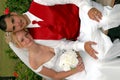 Bride and groom on park bench Royalty Free Stock Photo