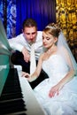 Bride and groom at piano Royalty Free Stock Photo