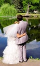 Bride and groom on the pond