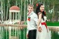 Bride and groom posing in amusement park Royalty Free Stock Photo