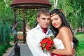 Bride and groom posing in amusement park Royalty Free Stock Photo