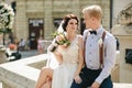 Bride and groom posing at the fountain