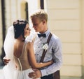 The bride and groom posing