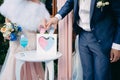 The bride and groom pour colored sand into a decorative heart at the wedding ceremony Royalty Free Stock Photo