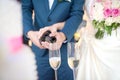Bride and groom pouring champagne at a wedding ceremony.