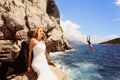 Bride and groom relaxing near water Royalty Free Stock Photo