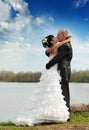 Bride and groom on the river