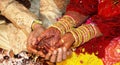 Bride and Groom's hand with Henna tattoo Royalty Free Stock Photo