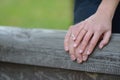 The bride and groom`s hands with rings