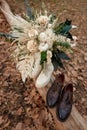 bride and groom shoes, wedding bouquet outdoor. Royalty Free Stock Photo