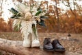 bride and groom shoes, wedding bouquet outdoor.