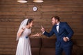 Bride and groom shouting at each other