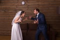 Bride and groom shouting at each other