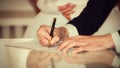 Bride and Groom Signing Marriage Certificate, wedding moments Royalty Free Stock Photo