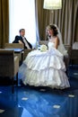 Bride and the groom sit at a table in the hotel bar Royalty Free Stock Photo