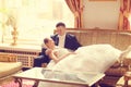 Bride and groom on sofa Royalty Free Stock Photo