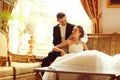 Bride and groom on sofa Royalty Free Stock Photo