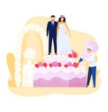 Bride and groom stand atop a huge wedding cake as chef decorates it. Pastry chef in white uniform adorning a multi Royalty Free Stock Photo